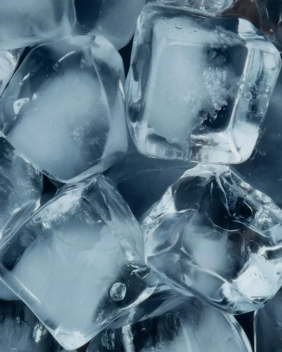 Close-up of ice cubes in blue light