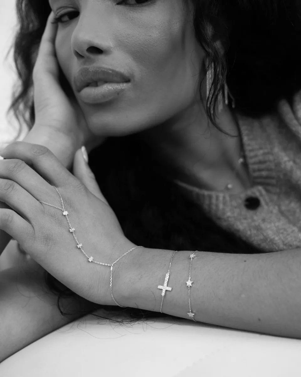 Black and white close-up of a woman with delicate jewellery, Atamant by Christie