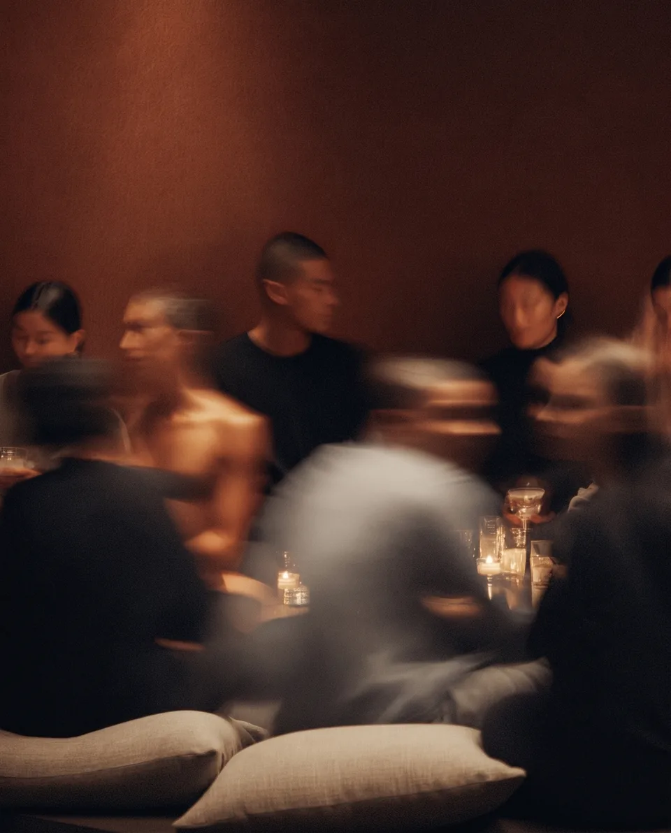 AI-generated social scene at Chairon House with blurred guests