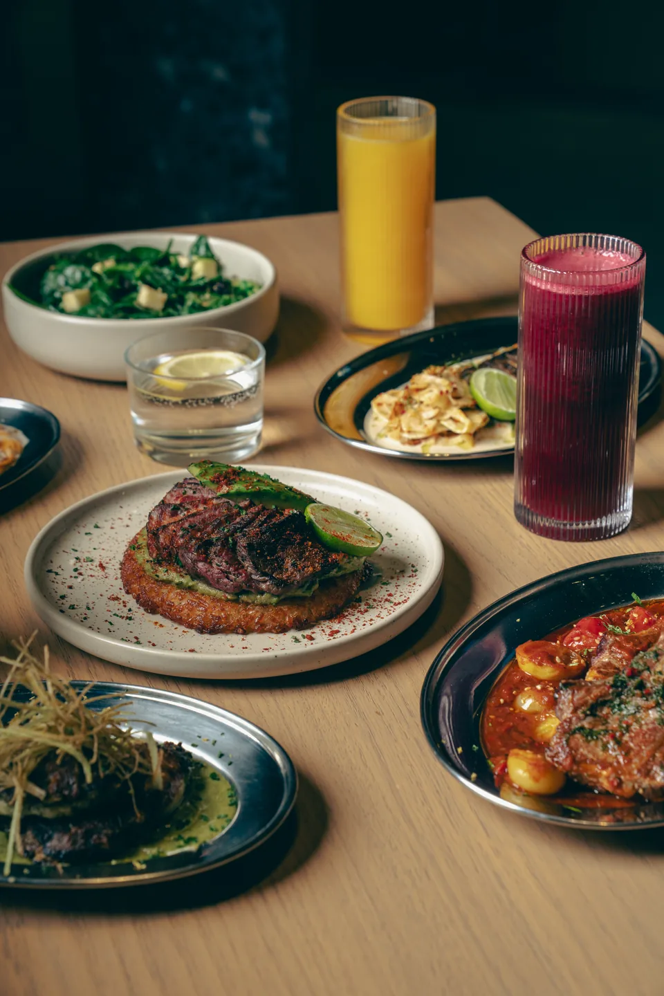 Table of shared dishes and fresh juices, Of The Earth